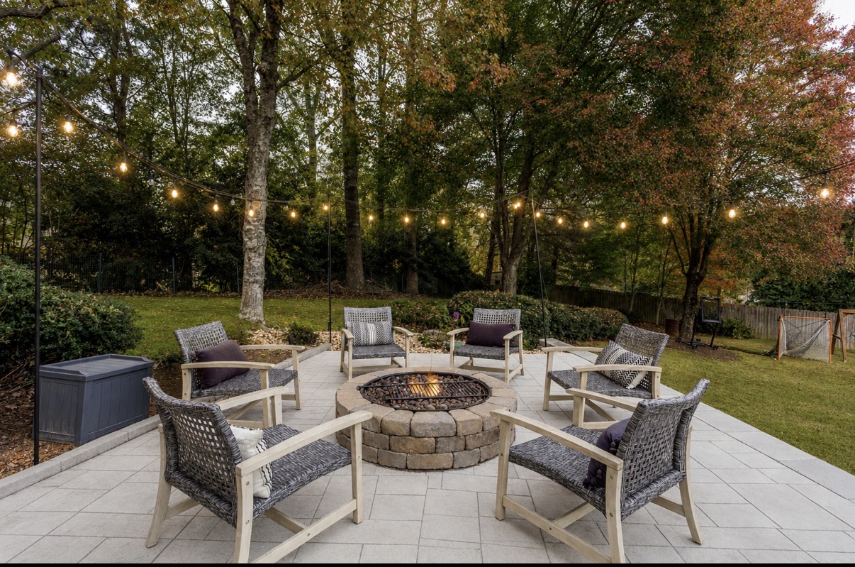 Backyard renovation with stamped concrete patio and custom gas fire pit